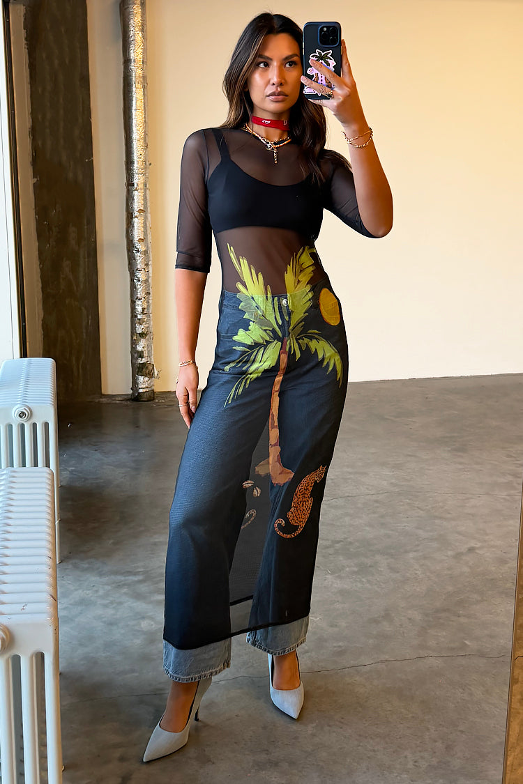 caption_Model wears Black Ibiza Mesh Izzy Dress in UK size 10/ US 6