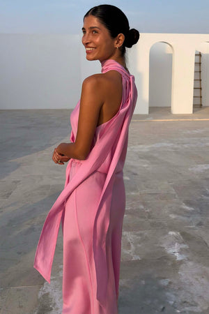 Pink Billie Top featuring a draped halterneck and long multi-wear ties in a soft pink shade, designed in London.