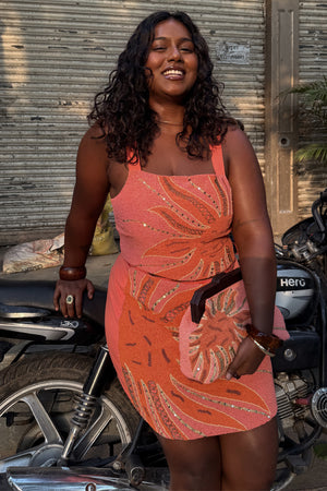 Pink Sol Beaded Top with a sequin sun print, styled as a co-ord for a London street style look.