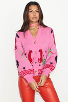 Thumbnail for caption_Model wears Pink Solstice Cardigan in UK size 8/ US 4