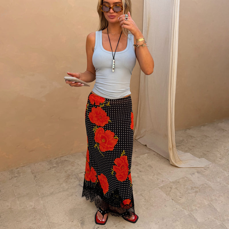 Black Poppy Midi Maeva Skirt in an iconic red floral and polka dot print with a black lace border.