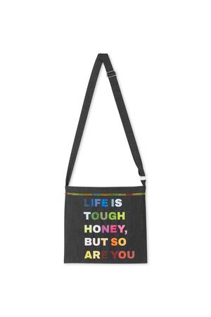 Charcoal Life is Tough Honey drainage bag with multi-coloured text and an adjustable shoulder strap.