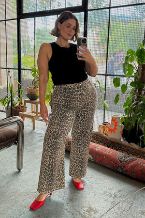 Black Ribbed Tank in soft stretch fabric, styled with leopard print trousers and red heels for a London look.