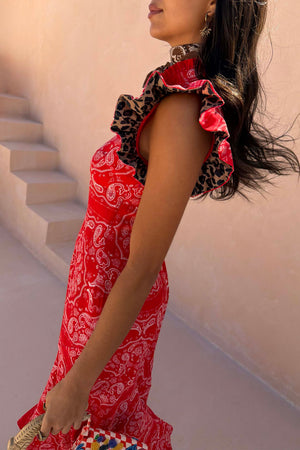 Red Bandana Remi Dress featuring leopard print pleated frill sleeves and a high neckline in a side profile.