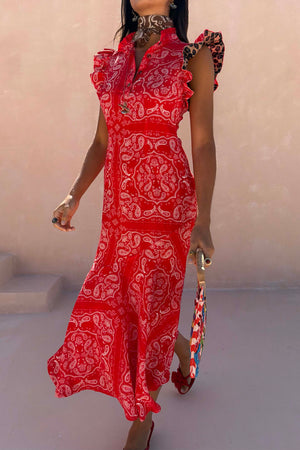 Red Bandana Remi Dress featuring leopard print ruffle sleeves and a frilled neckline in a sunny outdoor setting.