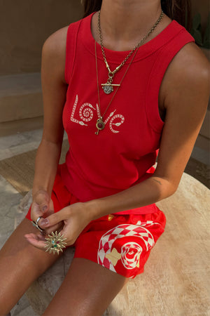 Red Snake Elissa Shorts with a checkerboard rose print and a matching red LOVE snake motif tank top.