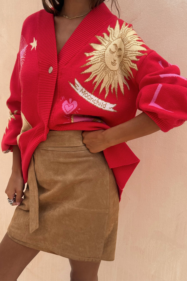 Tan brown Suede Mini Jaspre Skirt in a wrap style paired with a red mystical sun print cardigan.