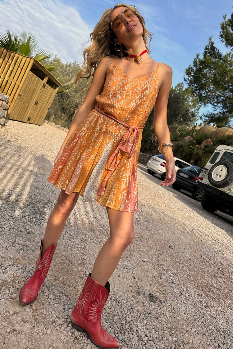 caption_Model wears Desert Sunrise Riri Mini Dress  in UK size 10/ US 6
