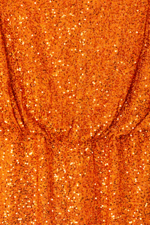 Orange Sequin Tilly Dress detail highlighting shimmering burnt orange sequins and an elasticated waist.