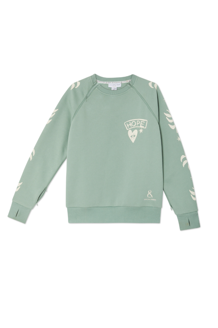 Sage green Sundazed Accessible Sweatshirt with cream palm prints, HOPE graphic, and concealed zips for treatment access.
