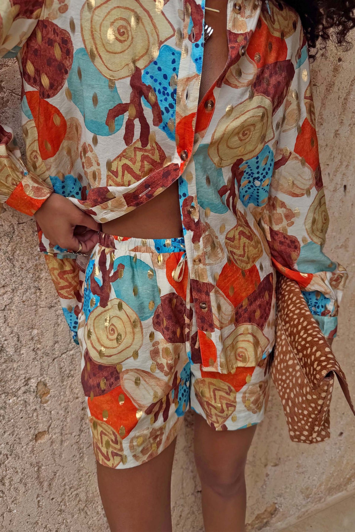 Shell Ellie Shorts in an abstract shell print with metallic detailing, styled as a summer co-ord.