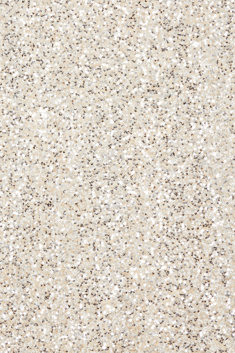 Silver Sequin Mini Soho Dress fabric detail featuring shimmering silver sequins on a neutral base.