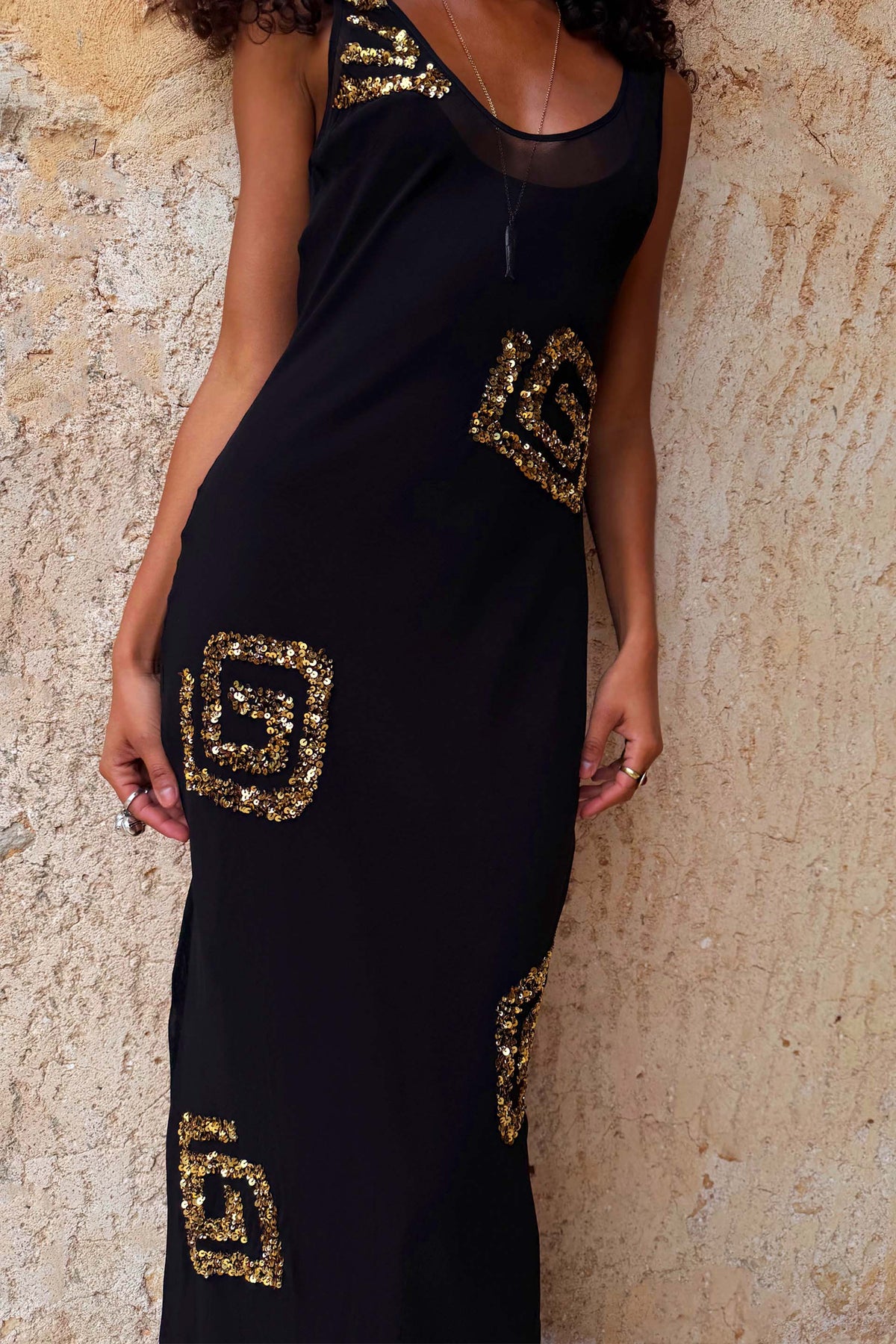 Black & Gold Simona Maxi Dress with geometric sequin patterns and a sheer mesh scoop neckline.