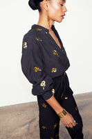 Thumbnail for caption_Model wears Black Gold Snake Elissa Trousers in UK size 10/ US 6
