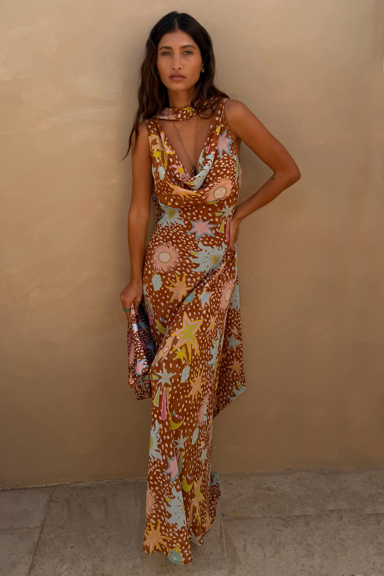 Star Fawn Sophie Dress in brown with sun motifs, featuring a draped neck and matching detachable scarf.
