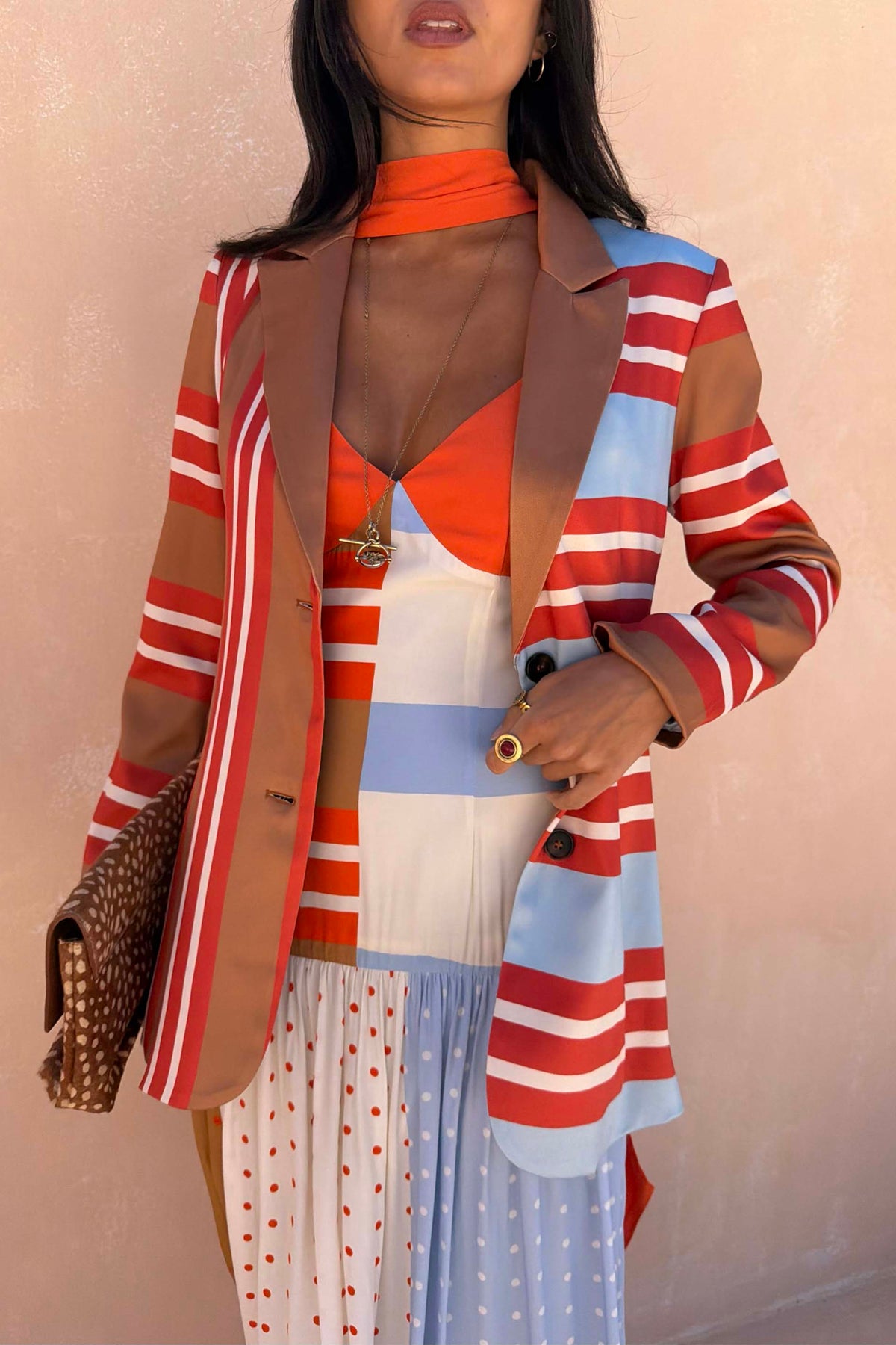 Longline Multi Stripe Blazer in red and blue, designed in London and styled with a leopard print clutch.