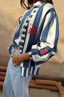 Thumbnail for caption_Model wears Blue Stripe Sunny Cardigan in UK size 10/ US 6