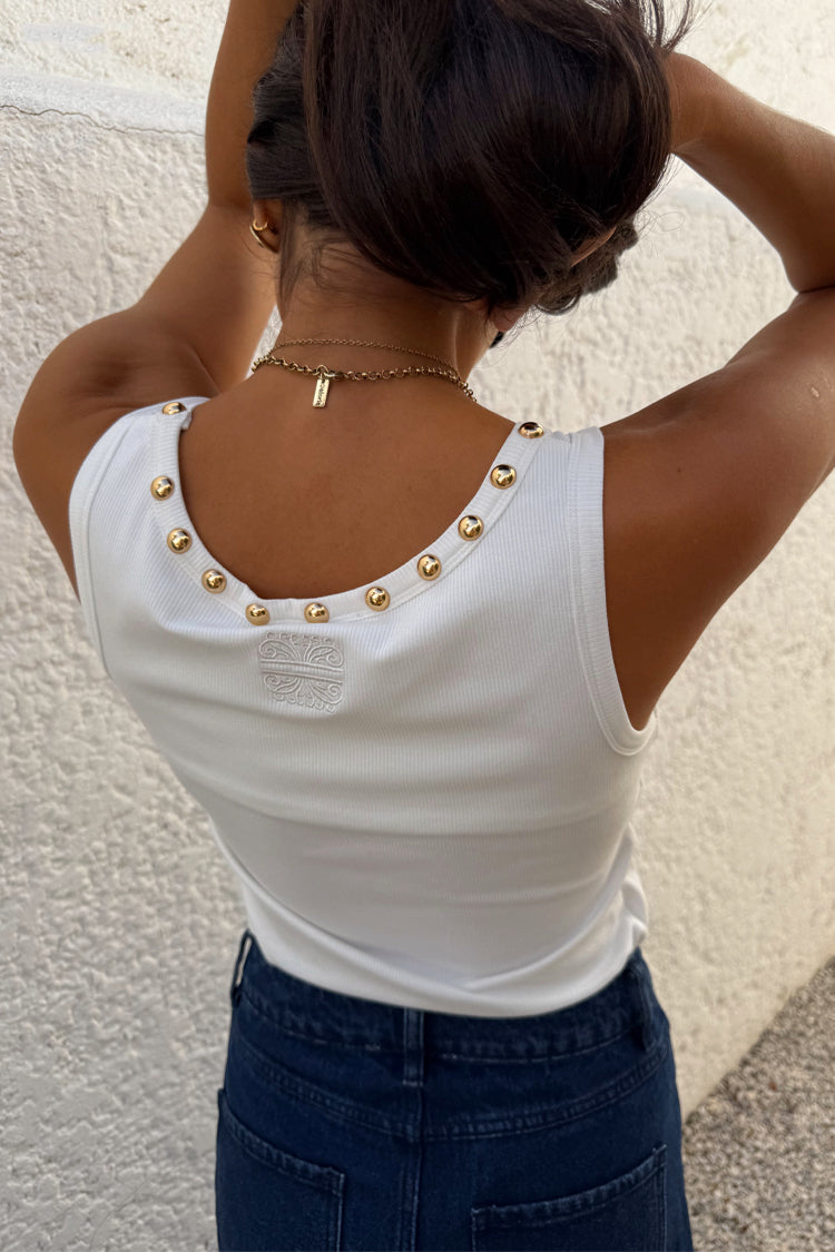 Back view of the White Studded Rib Vest in white ribbed fabric with gold stud detailing and embroidered logo.