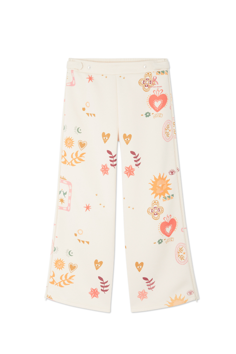 Cream Sundazed Wide Leg Accessible Joggers featuring an iconic motif print and adjustable side zips.