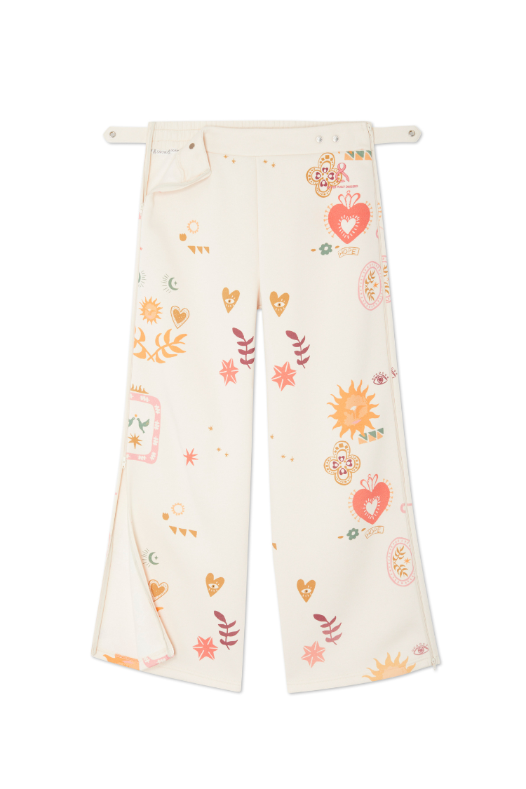 Cream Sundazed Wide Leg Accessible Joggers featuring sun and heart motifs, side zips and an adjustable popper waist.