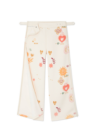Cream Sundazed Wide Leg Accessible Joggers featuring NFD print motifs, concealed side zips, and popper waistband.