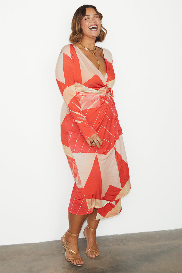 caption_Model wears Reversible Sundial Wrap Dress in UK size 18 / US 14