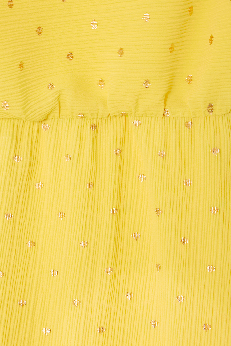 Sunshine Tilly Dress detail highlighting the yellow plisse fabric, gold flecks and elasticated waistband.