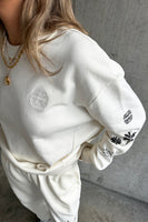 Thumbnail for caption_Model wears White Tattoo Sweatshirt in UK size 10/ US 6