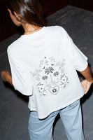 Thumbnail for caption_Model wears White Tattoo T-Shirt in size S