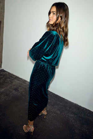 Emerald Velvet Tilly Dress with sparkly silver dots, a voluminous top and fitted skirt on a model.