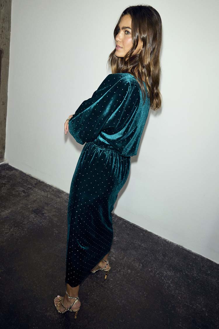 Emerald Velvet Tilly Dress with sparkly silver dots, a voluminous top and fitted skirt on a model.
