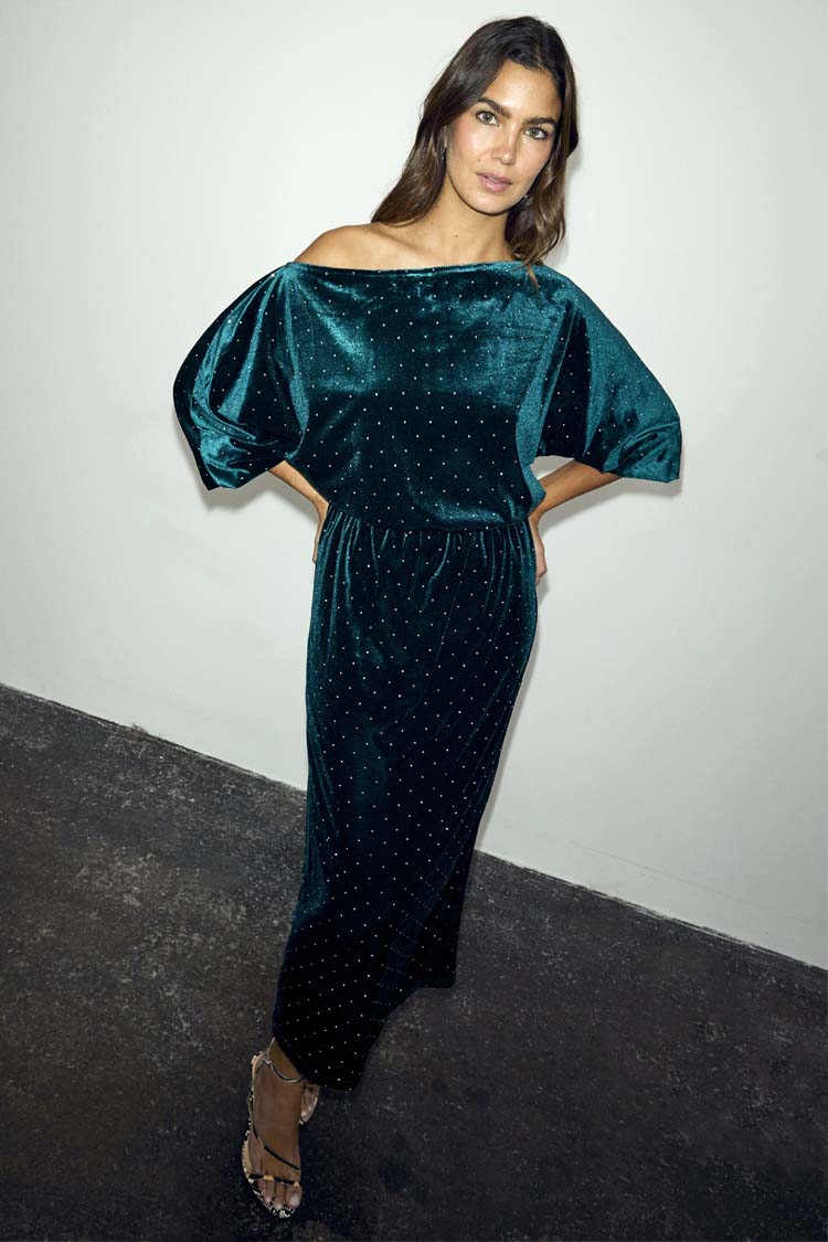 Emerald Velvet Tilly Dress featuring an off-the-shoulder neckline and voluminous sleeves on a model.