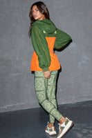 Thumbnail for caption_Model wears Khaki and Orange NFD Windbreaker in UK size 8/ US 4