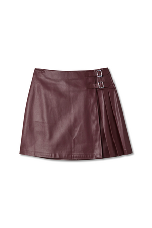 Burgundy vegan leather mini kilt skirt featuring pleated side detailing and silver-tone buckle fastenings.