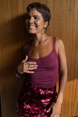 Burgundy Teddy Vest with mesh detailing at the neckline, paired with a sequinned skirt for evening styling.
