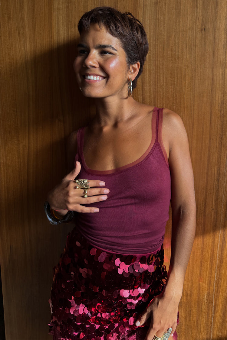 Burgundy Teddy Vest with mesh detailing at the neckline, paired with a sequinned skirt for evening styling.