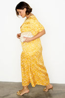 Thumbnail for caption_Model wears Yellow Mosaic May Dress in UK size 18/ US 14