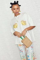 Thumbnail for caption_Model wears Lemon Boob T-shirt in UK size 10/ US 6