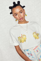 Thumbnail for caption_Model wears Lemon Boob T-shirt in UK size 10/ US 6