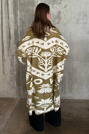 Olive Amara Knit Coatigan with white Mediterranean motifs, featuring an oversized longline fit from the back.