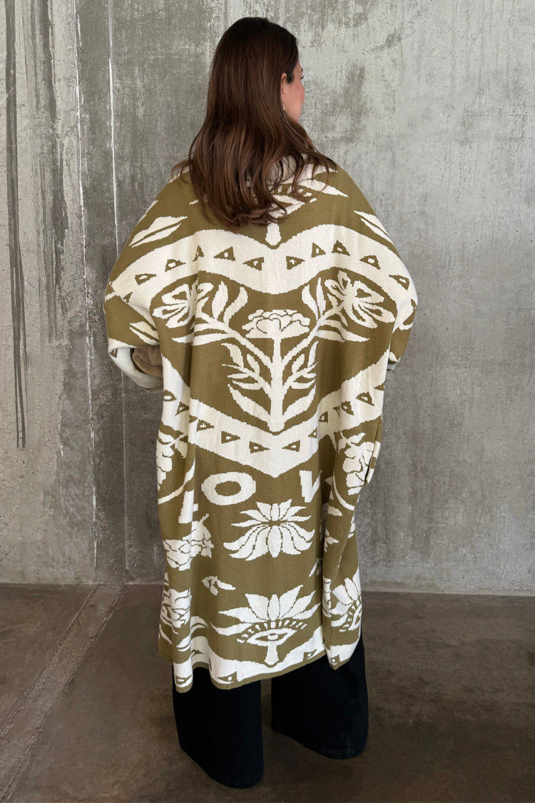 Olive Amara Knit Coatigan with white Mediterranean motifs, featuring an oversized longline fit from the back.