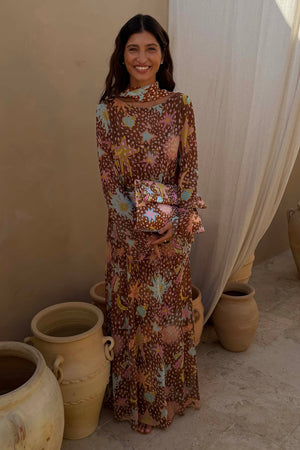 Star Fawn Aria Mesh Dress in brown with sun and star motifs, featuring flared sleeves and a matching scarf.