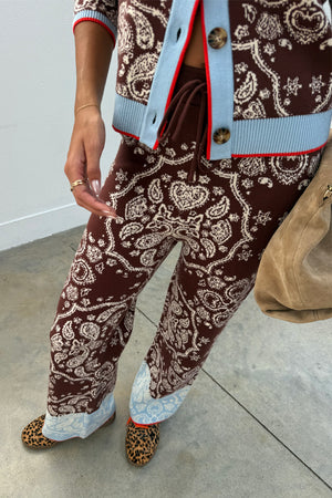 Chocolate brown bandana wide leg knit trousers featuring a blue contrast hem and drawstring waistband.