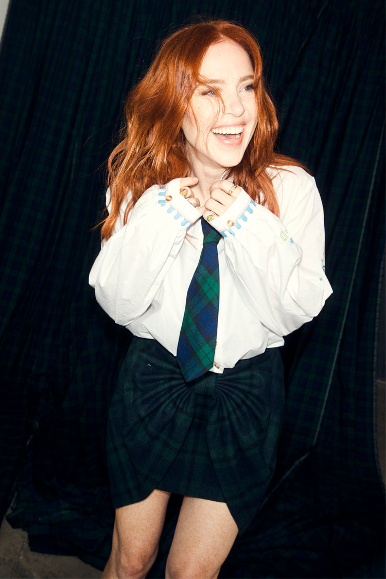 Never Fully Dressed Choose Love Miley Shirt in white cotton with scalloped cuffs, worn by Angela Scanlon with a tartan tie.