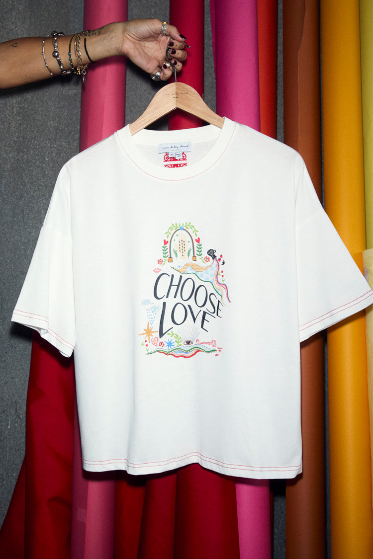 White cotton Choose Love T-Shirt featuring a colourful front graphic and red contrast stitch detailing.
