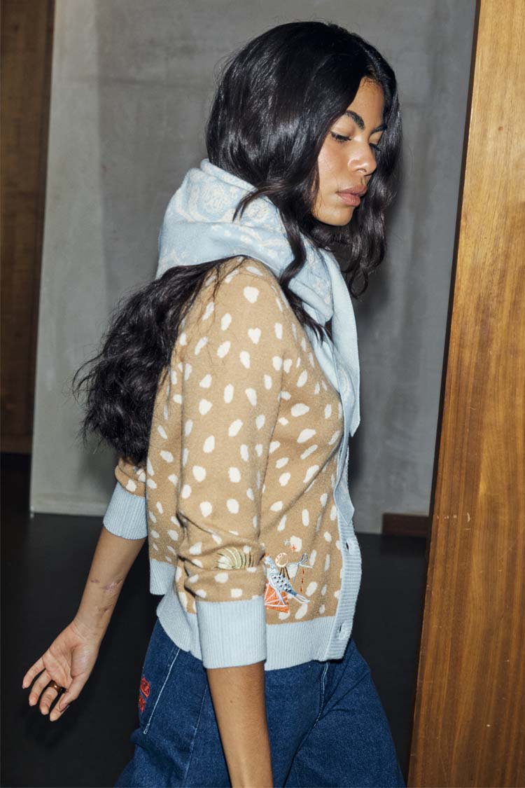 Deer Print Hollie Cardigan in beige and white with light blue cuffs, paired with a matching scarf.