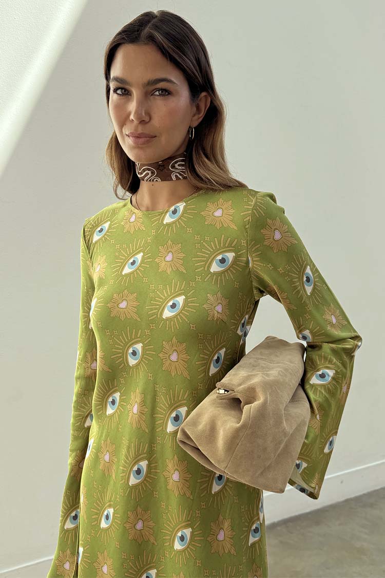 Khaki Eye Mini Soho Dress Petite with the iconic green eye print, flared sleeves, a neck scarf and tan clutch bag.