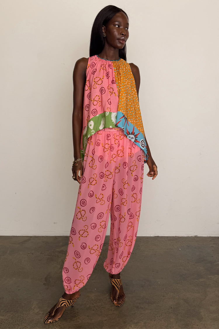 Pink Snake Balloon Trouser in dusky pink with a snake print and balloon silhouette, styled with a multi-print top.