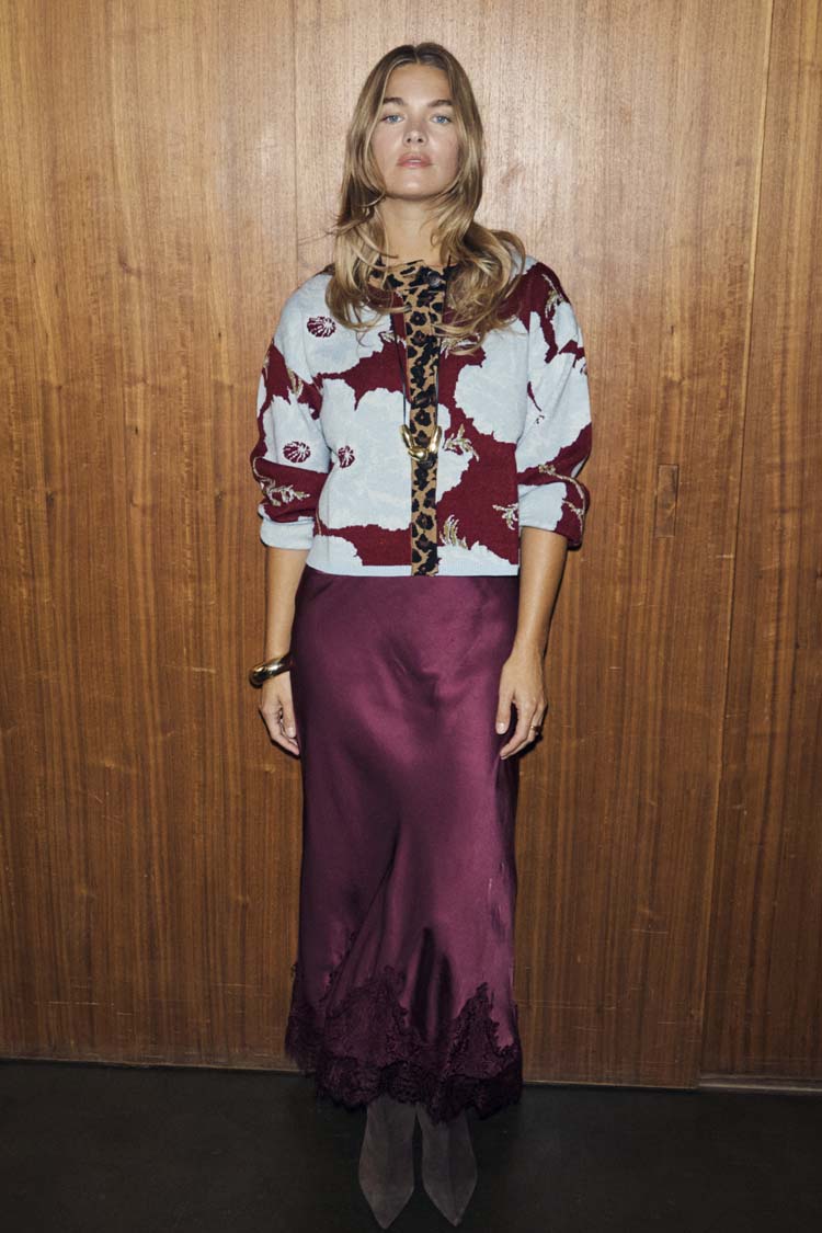 Burgundy and blue poppy print knit cardigan with leopard trim, styled with a long satin skirt.