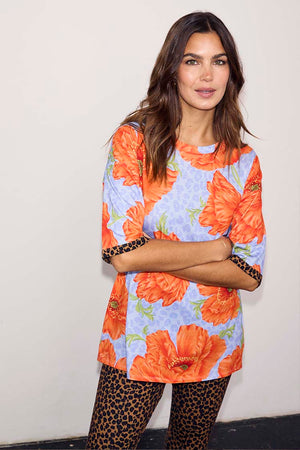 NFD Blue Poppy Print Jersey Pyjamas with orange poppies and leopard print trousers on a model.